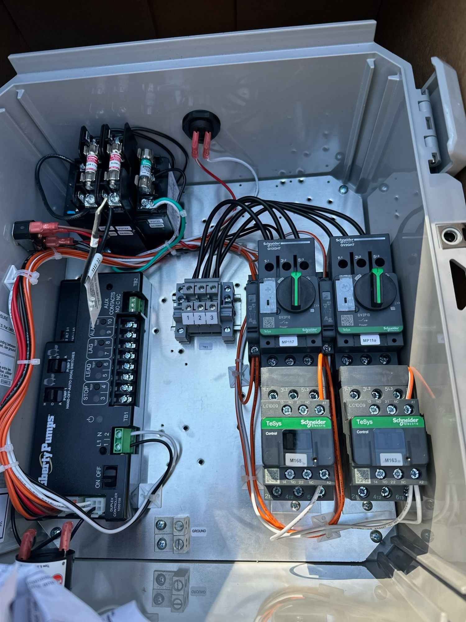 Interior wiring of a Liberty Pumps duplex control panel with Schneider Electric motor starters